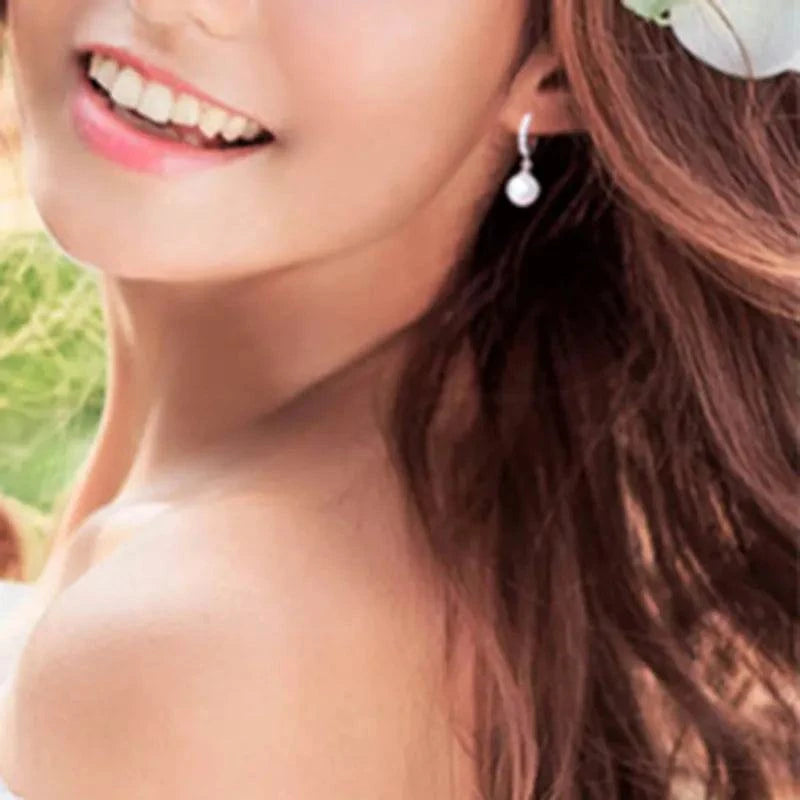 Sterling Silver Pearls EarringsDescription: These elegant drop earrings are a testament to exquisite craftsmanship and timeless beauty. Designed with meticulous attention to detail, they are the pSHOP ALL I WANTShop All I WantSterling Silver Pearls Earrings