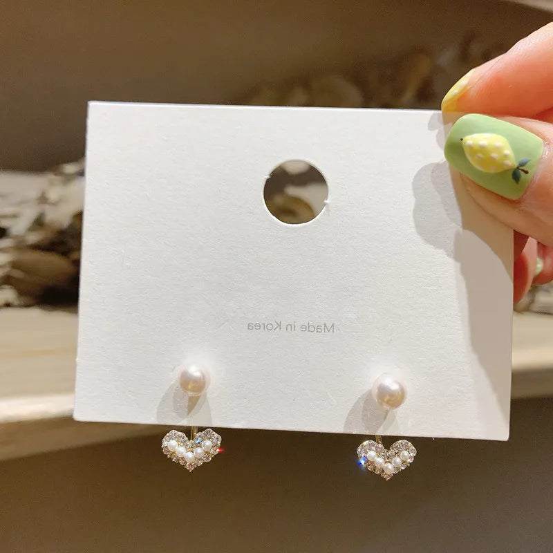 Heart Pearl Drop Earrings 💖✨Add a touch of romance and elegance to your look with our Heart Pearl Drop Earrings - a charming and timeless accessory that complements your style with grace and beSHOP ALL I WANTShop All I WantHeart Pearl Drop Earrings