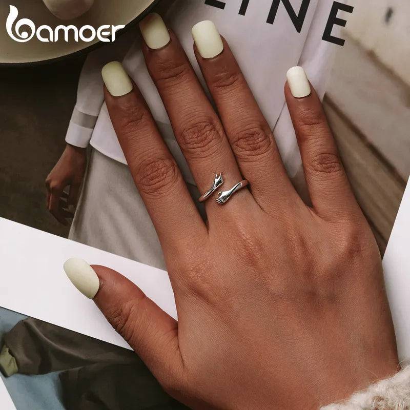 Sterling Silver Hug Ring 🤗 💍Introducing the "His Big Loving Hugs" Adjustable Sterling Silver Ring ❤
Description: Sometimes, words can't express what a simple, loving hug can. This beautifullSHOP ALL I WANTShop All I WantSterling Silver Hug Ring