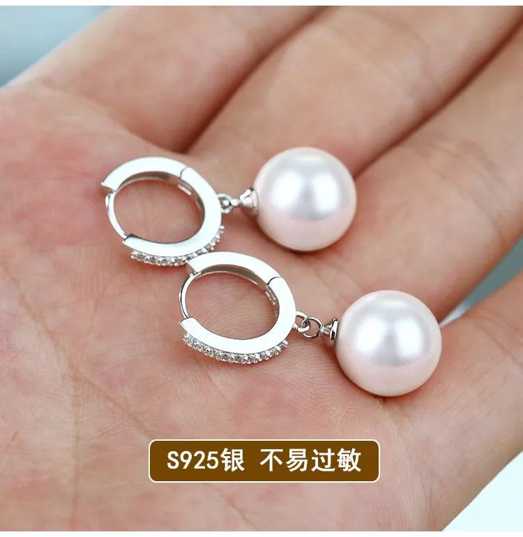 Sterling Silver Pearls EarringsDescription: These elegant drop earrings are a testament to exquisite craftsmanship and timeless beauty. Designed with meticulous attention to detail, they are the pSHOP ALL I WANTShop All I WantSterling Silver Pearls Earrings