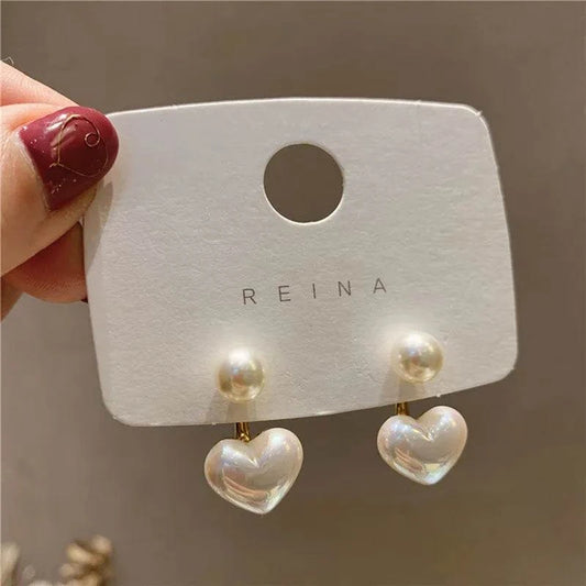 Heart Pearl Drop Earrings 💖✨Add a touch of romance and elegance to your look with our Heart Pearl Drop Earrings - a charming and timeless accessory that complements your style with grace and beSHOP ALL I WANTShop All I WantHeart Pearl Drop Earrings