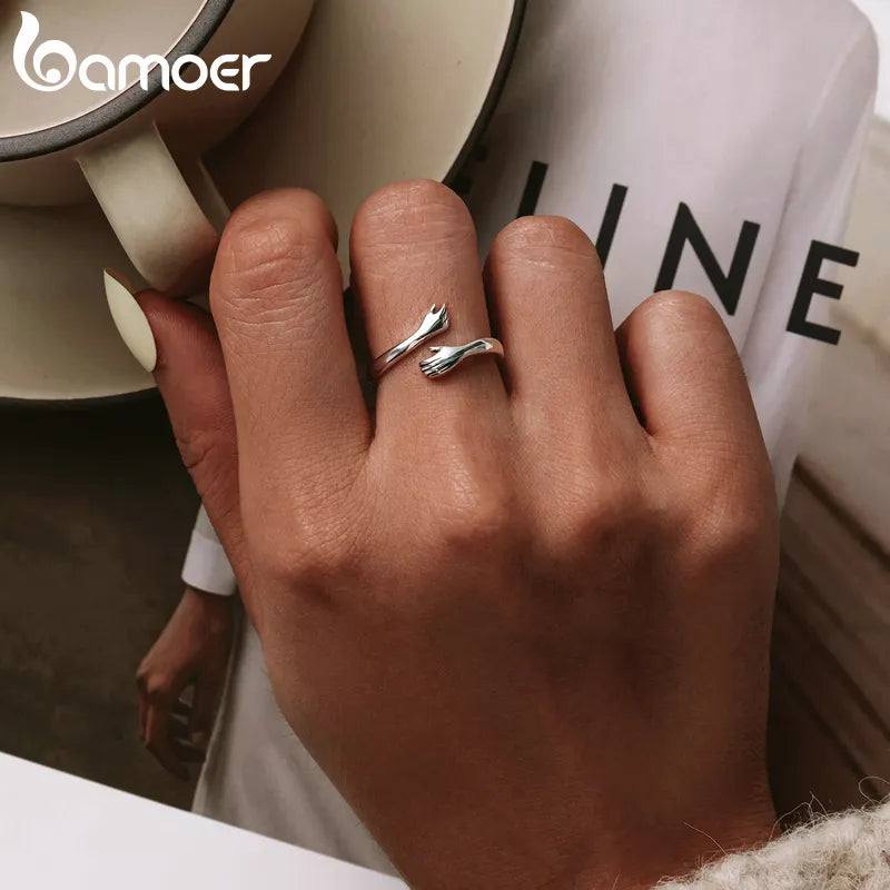 Sterling Silver Hug Ring 🤗 💍Introducing the "His Big Loving Hugs" Adjustable Sterling Silver Ring ❤
Description: Sometimes, words can't express what a simple, loving hug can. This beautifullSHOP ALL I WANTShop All I WantSterling Silver Hug Ring
