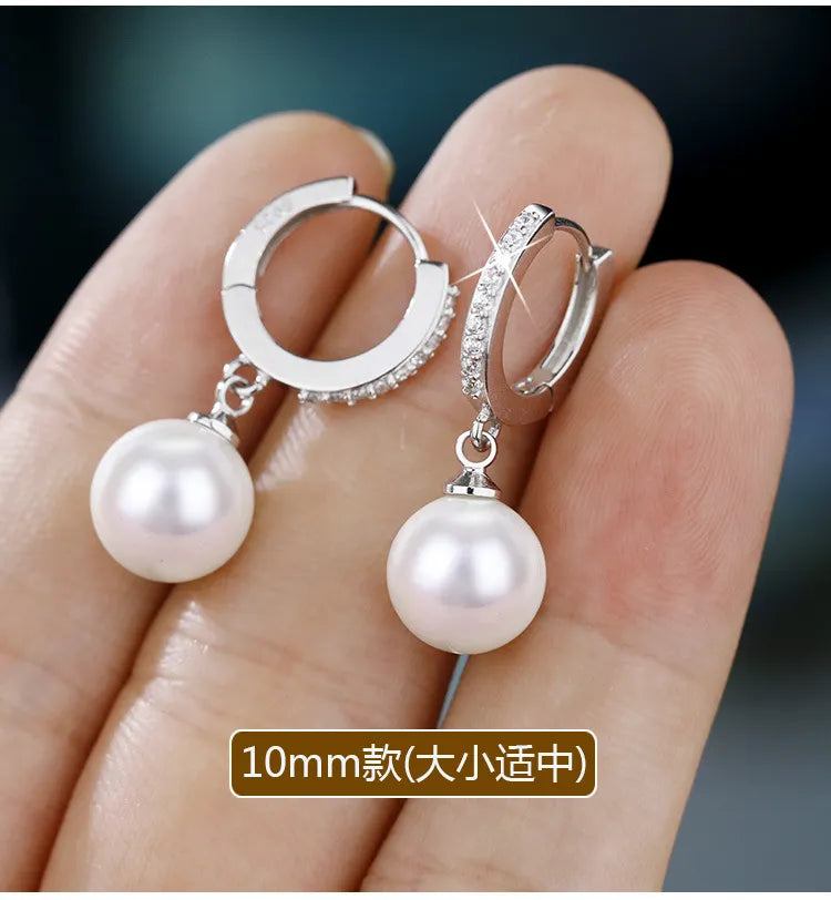 Sterling Silver Pearls EarringsDescription: These elegant drop earrings are a testament to exquisite craftsmanship and timeless beauty. Designed with meticulous attention to detail, they are the pSHOP ALL I WANTShop All I WantSterling Silver Pearls Earrings
