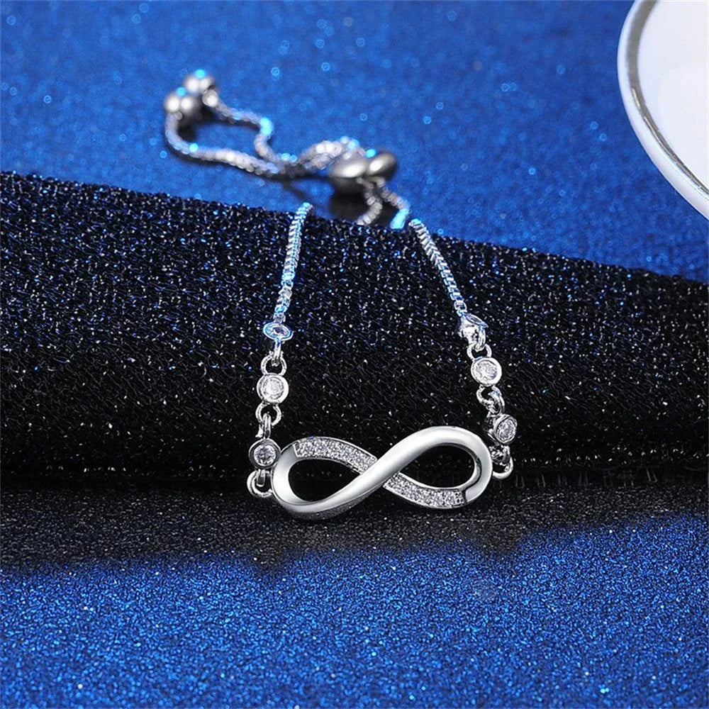 Shop All I Want Fashion Crystal Infinity Bracelet – Adjustable CZ Charm, Endless Love,Add a touch of elegance to any outfit with this Fashion Crystal Infinity Bracelet. Featuring a stunning CZ charm and an adjustable design, it's a perfect summer acceShop All I WantShop All I Wantfashion crystal infinity bracelet – elegant cz charm accessory