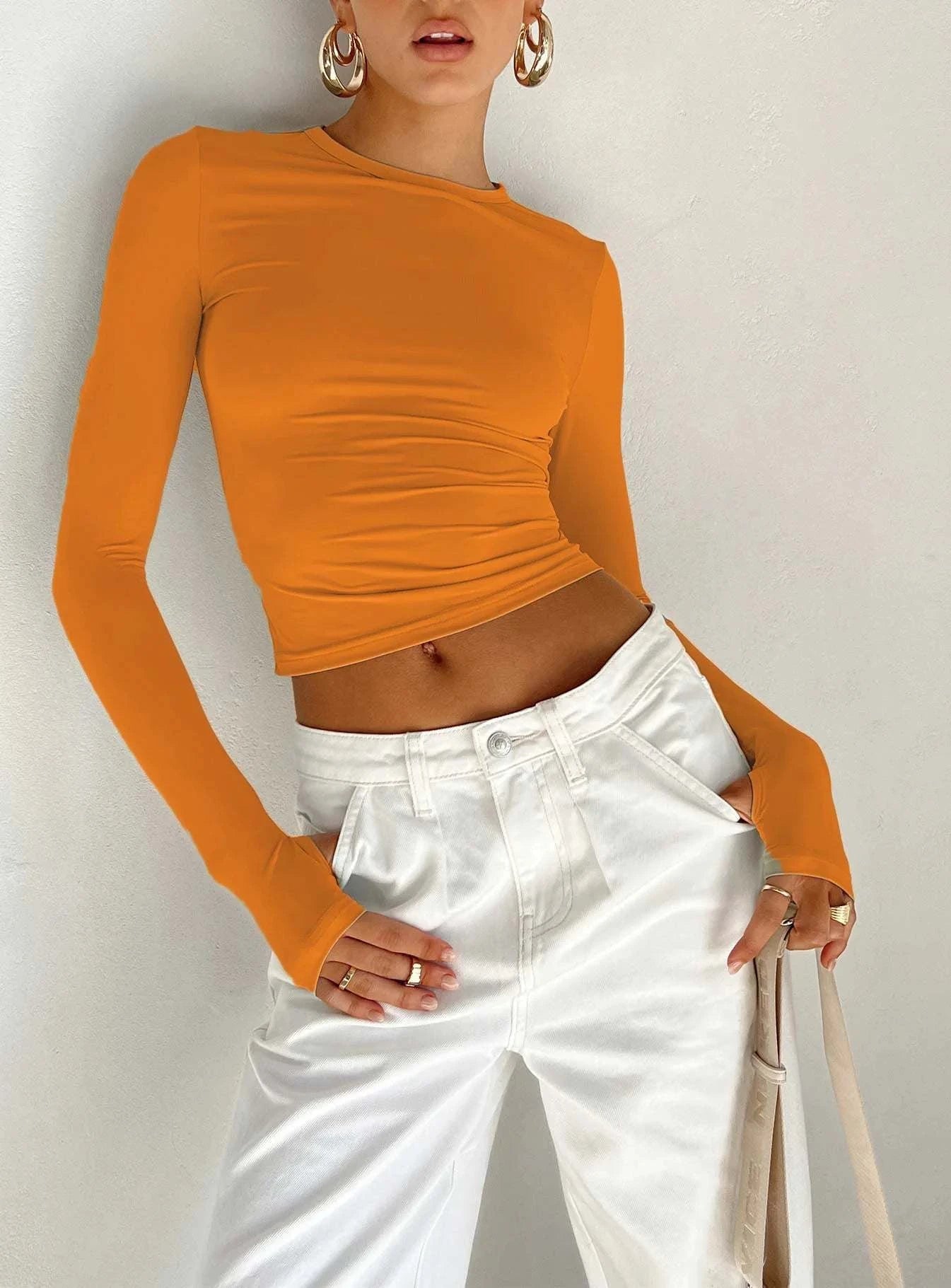 Slim Fit Long Sleeve Crop TopElevate your casual look with the Chic Long Sleeve Crew Neck Crop Top. Designed for the modern woman, this slim-fit tee features a trendy crew neck and convenient thSHOP ALL I WANTShop All I WantSlim Fit Long Sleeve Crop Top