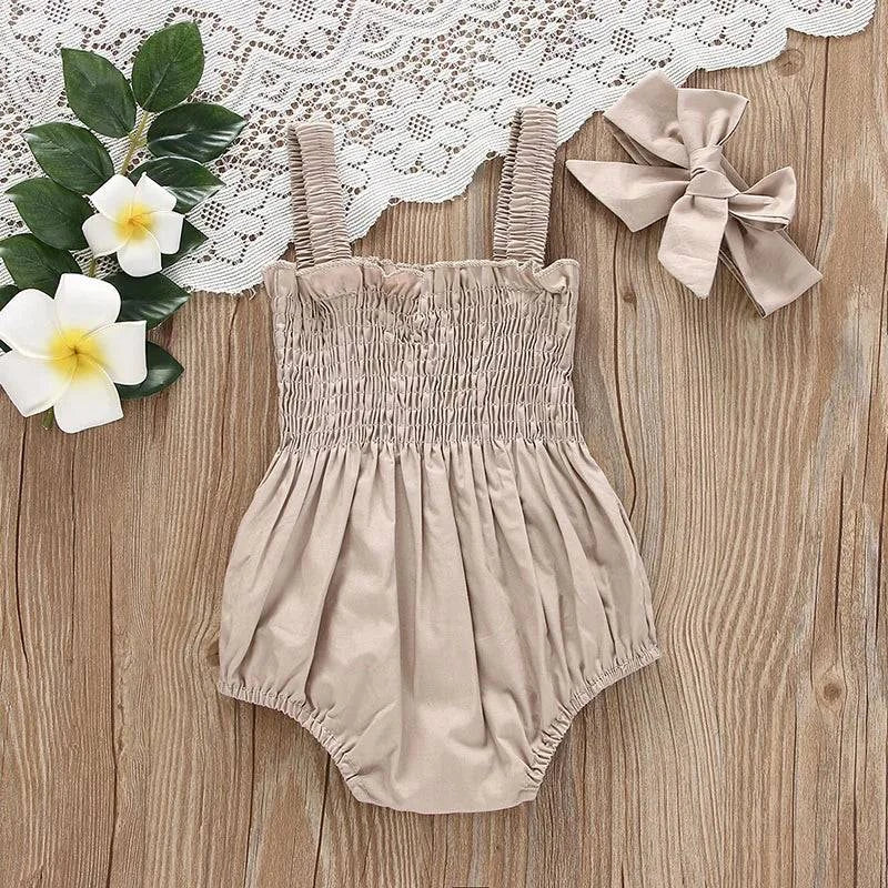 Baby Summer Jumpsuit – Solid Color, Ruched Romper with Sleeveless SuspOutfit your little one in adorable style with this Baby Summer Jumpsuit. The solid color, ruched romper comes with a sleeveless suspender design and a matching headbShop All I WantShop All I WantBaby Summer Jumpsuit