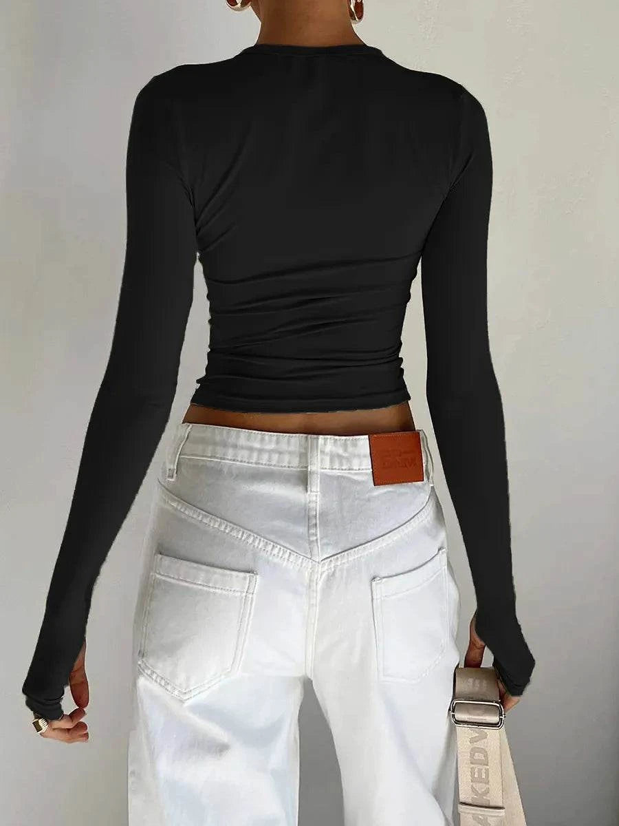 Slim Fit Long Sleeve Crop TopElevate your casual look with the Chic Long Sleeve Crew Neck Crop Top. Designed for the modern woman, this slim-fit tee features a trendy crew neck and convenient thSHOP ALL I WANTShop All I WantSlim Fit Long Sleeve Crop Top