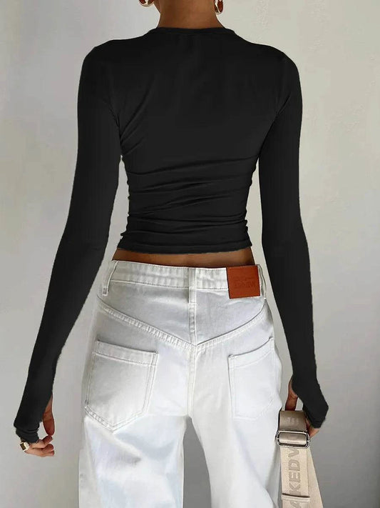 Slim Fit Long Sleeve Crop TopElevate your casual look with the Chic Long Sleeve Crew Neck Crop Top. Designed for the modern woman, this slim-fit tee features a trendy crew neck and convenient thSHOP ALL I WANTShop All I WantSlim Fit Long Sleeve Crop Top
