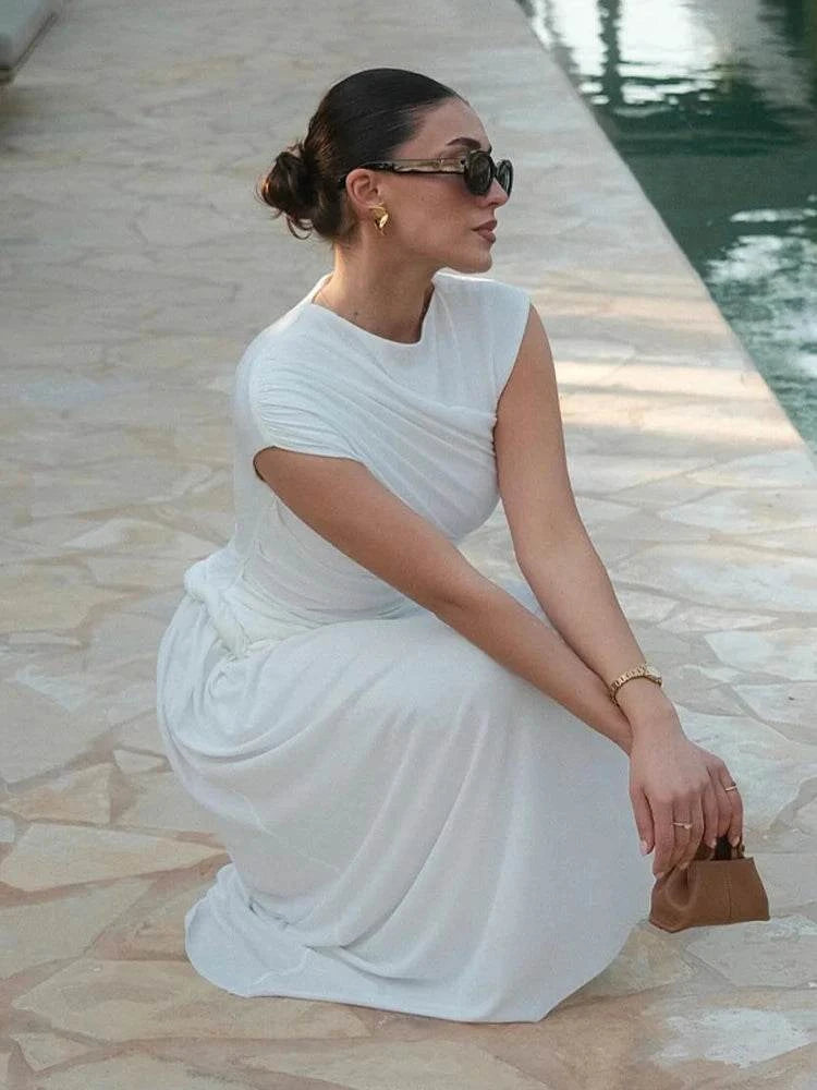Elegant White Bodycon DressMake a statement with this elegant white bodycon dress. Its sleek, form-fitting design exudes sophistication and style. 👗✨SHOP ALL I WANTShop All I WantElegant White Bodycon Dress