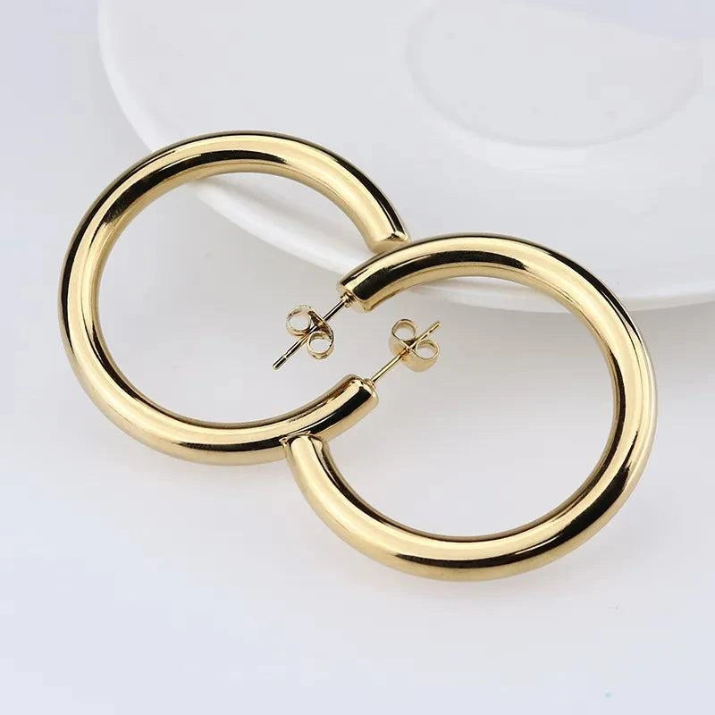 Oversize Gold Hoop Earring ππ« #PunkJewelryMake a bold and rebellious statement with our Oversize Gold Hoop Earring β a striking piece that embodies the essence of #PunkJewelry. These earrings are designed toSHOP ALL I WANTShop All I WantOversize Gold Hoop Earring