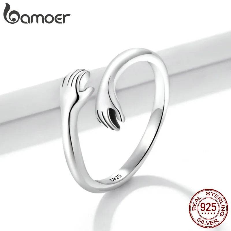 Sterling Silver Hug Ring 🤗 💍Introducing the "His Big Loving Hugs" Adjustable Sterling Silver Ring ❤
Description: Sometimes, words can't express what a simple, loving hug can. This beautifullSHOP ALL I WANTShop All I WantSterling Silver Hug Ring