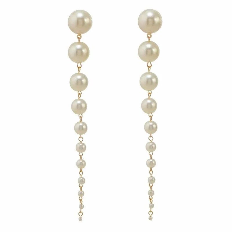 Long Pearl EarringsElevate your style with Long Pearl Earrings – more than just accessories, they're an embodiment of timeless elegance. Crafted with care, these earrings exude sophistSHOP ALL I WANTShop All I WantLong Pearl Earrings