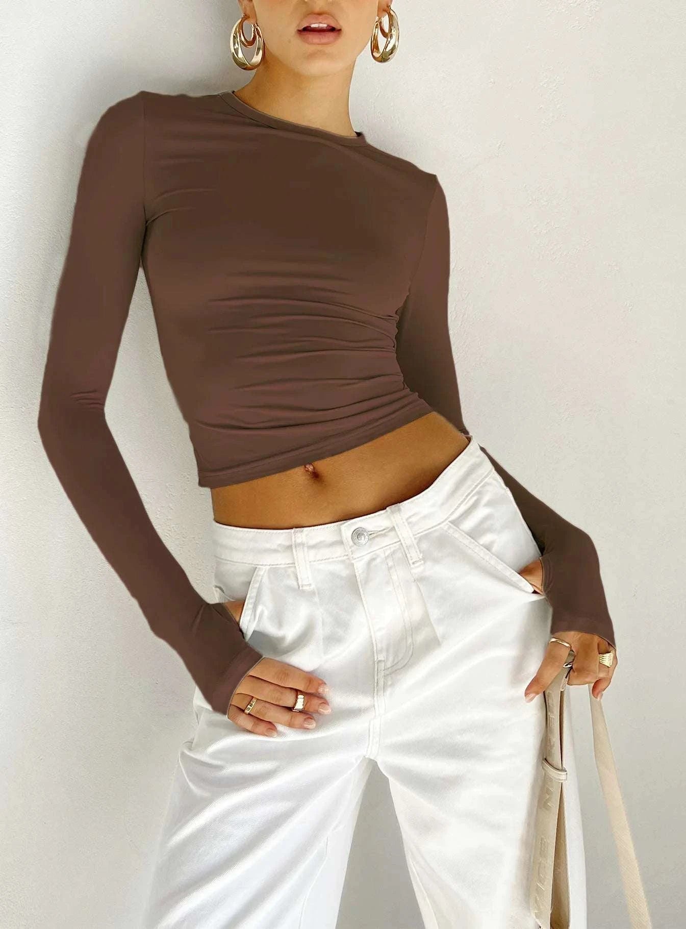 Slim Fit Long Sleeve Crop TopElevate your casual look with the Chic Long Sleeve Crew Neck Crop Top. Designed for the modern woman, this slim-fit tee features a trendy crew neck and convenient thSHOP ALL I WANTShop All I WantSlim Fit Long Sleeve Crop Top