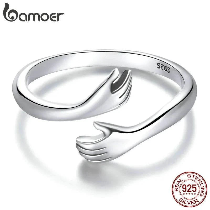 Sterling Silver Hug Ring 🤗 💍Introducing the "His Big Loving Hugs" Adjustable Sterling Silver Ring ❤
Description: Sometimes, words can't express what a simple, loving hug can. This beautifullSHOP ALL I WANTShop All I WantSterling Silver Hug Ring