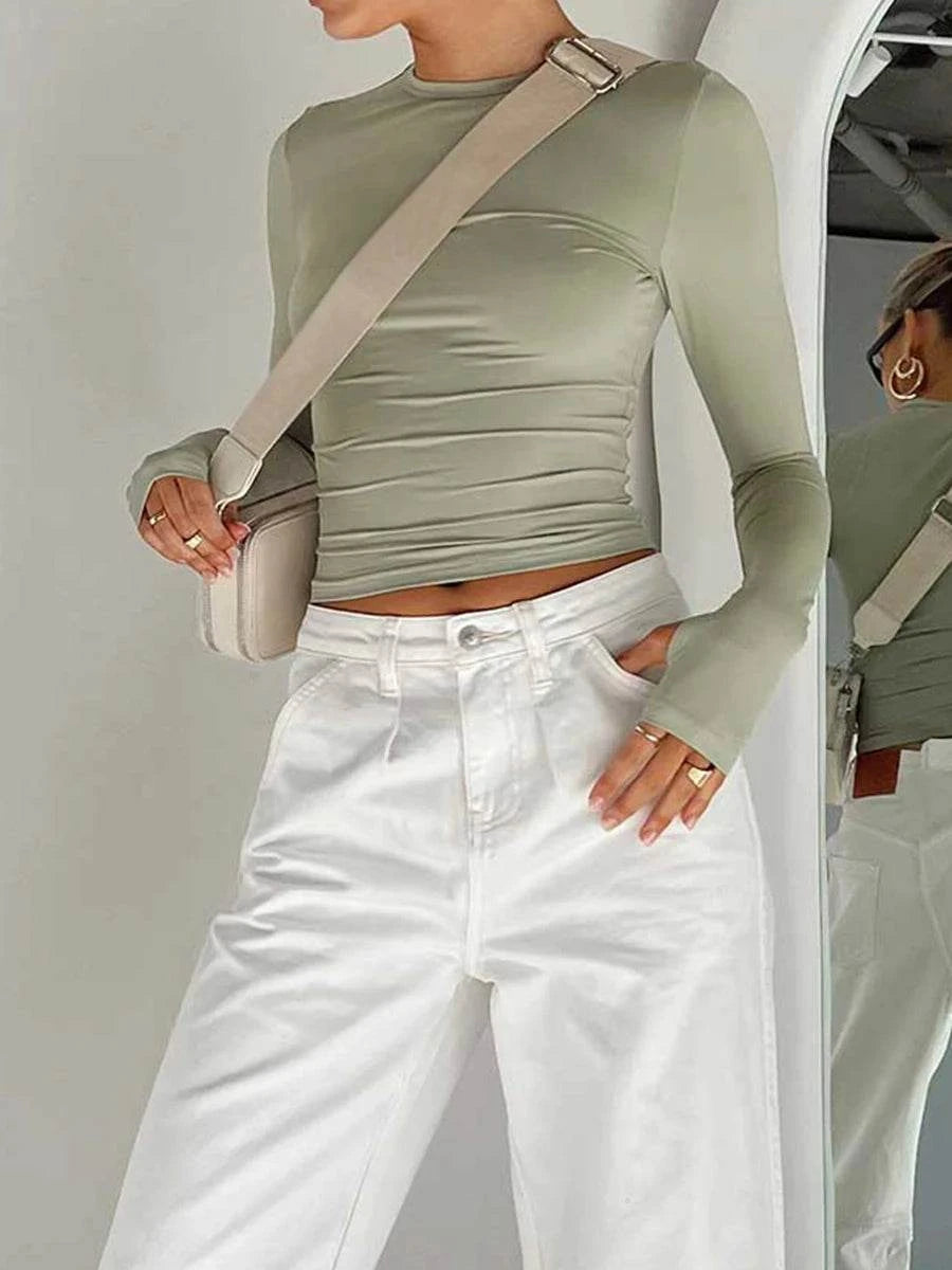 Slim Fit Long Sleeve Crop TopElevate your casual look with the Chic Long Sleeve Crew Neck Crop Top. Designed for the modern woman, this slim-fit tee features a trendy crew neck and convenient thSHOP ALL I WANTShop All I WantSlim Fit Long Sleeve Crop Top