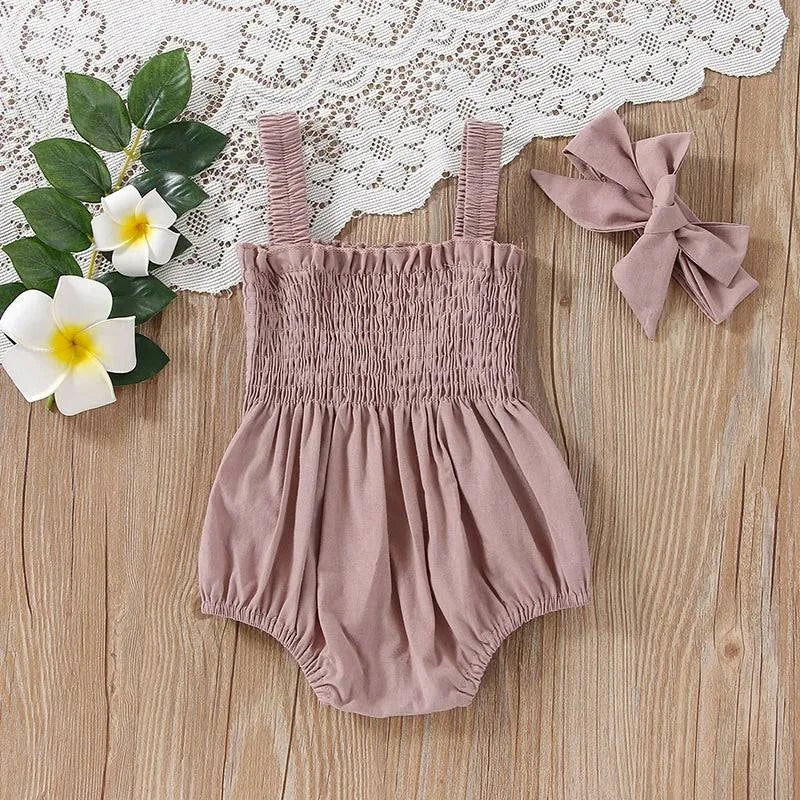 Baby Summer Jumpsuit – Solid Color, Ruched Romper with Sleeveless SuspOutfit your little one in adorable style with this Baby Summer Jumpsuit. The solid color, ruched romper comes with a sleeveless suspender design and a matching headbShop All I WantShop All I WantBaby Summer Jumpsuit