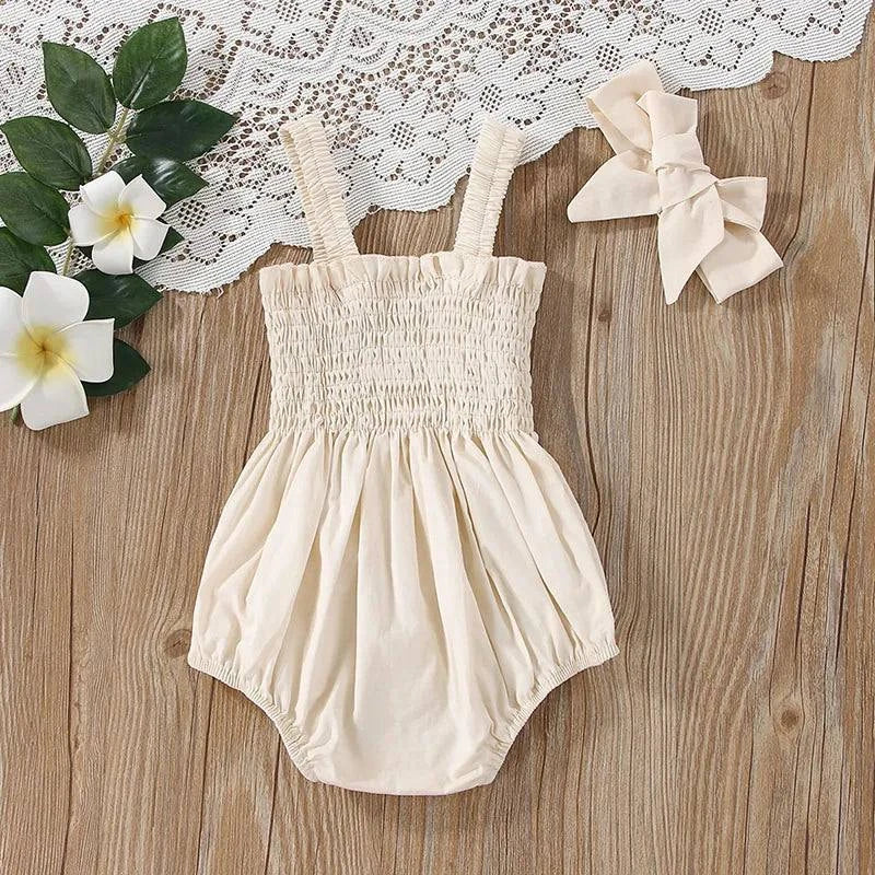 Baby Summer Jumpsuit – Solid Color, Ruched Romper with Sleeveless SuspOutfit your little one in adorable style with this Baby Summer Jumpsuit. The solid color, ruched romper comes with a sleeveless suspender design and a matching headbShop All I WantShop All I WantBaby Summer Jumpsuit