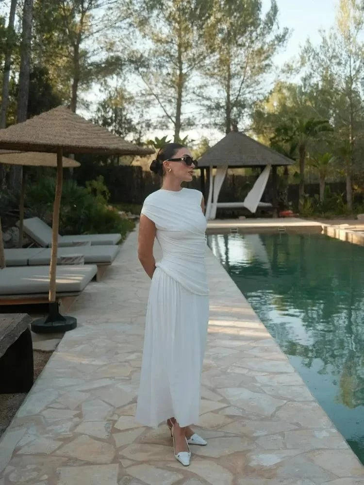 Elegant White Bodycon DressMake a statement with this elegant white bodycon dress. Its sleek, form-fitting design exudes sophistication and style. 👗✨SHOP ALL I WANTShop All I WantElegant White Bodycon Dress