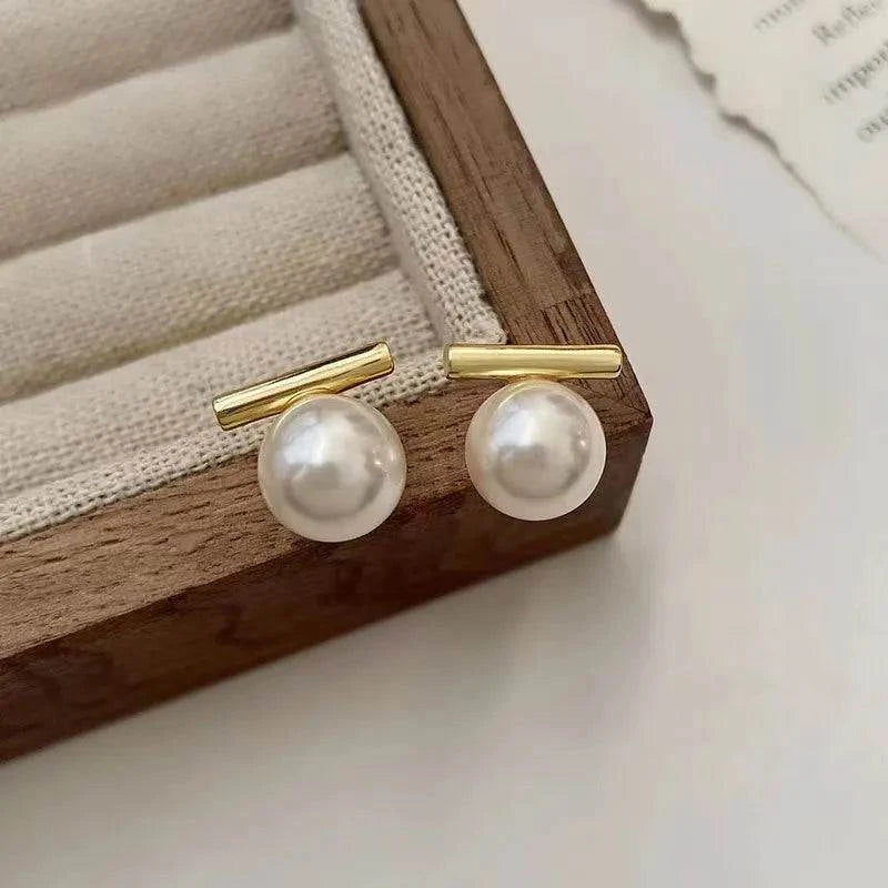 Shop All I Want White pearl SHOP ALL I WANT Elevate your elegance with our Silver Round Earrings! ✨👂💍